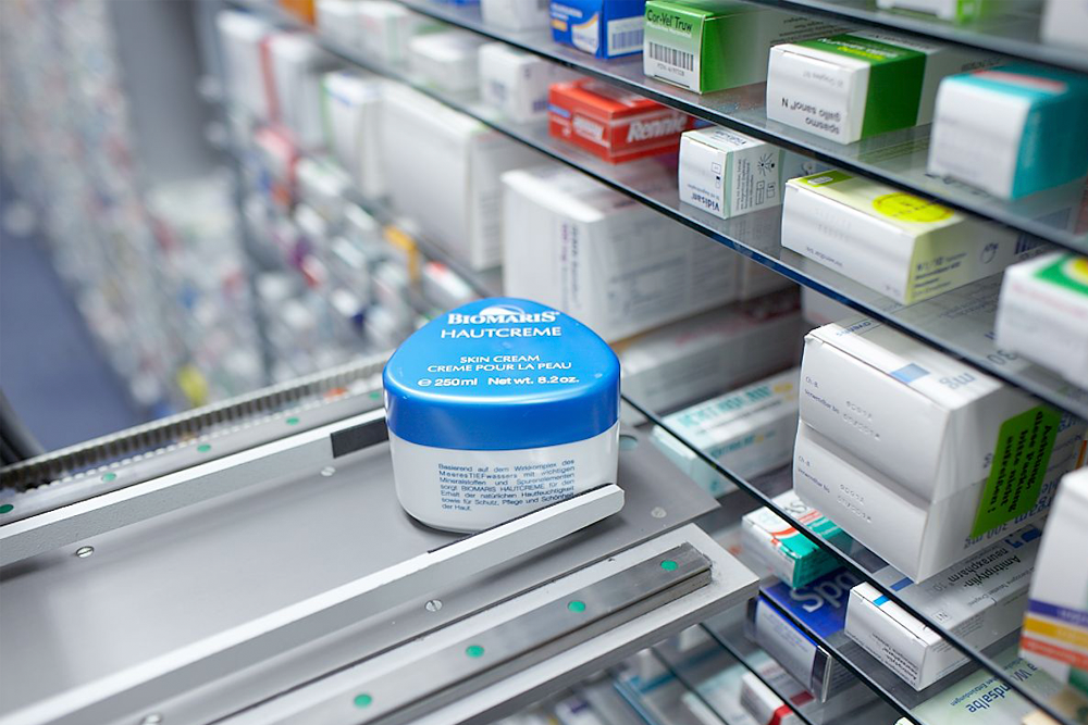 envases redondos en el robot de farmacia Apostore