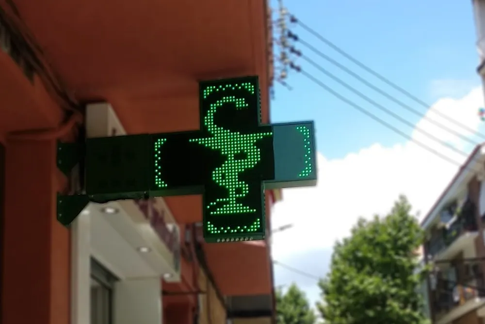 imagen de la cruz de farmacia venus con la copa y la serpiente de farmacia