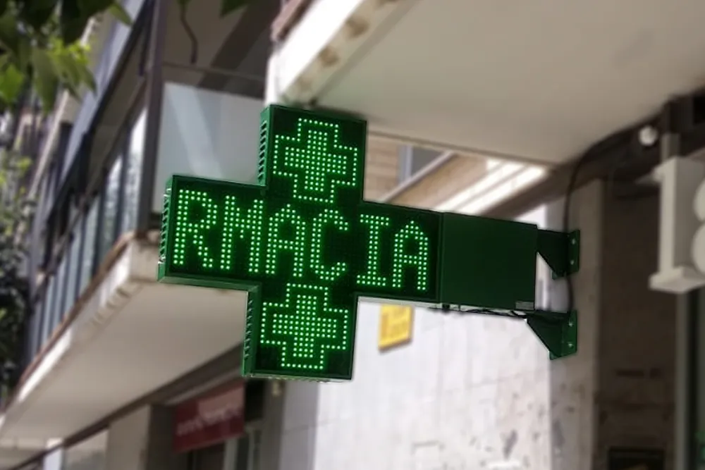 imagen de la cruz de farmacia venus con el texto de farmacia